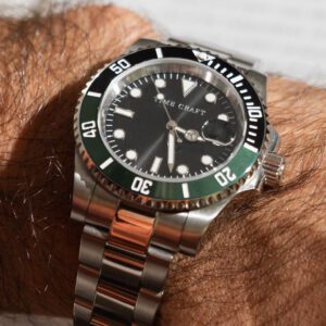 Green and black mechanical diver watchmaking kit components and assembly tools